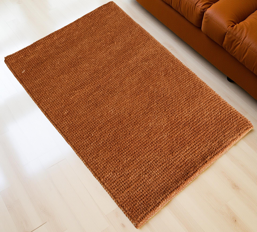 Orange Flat Weave Rug With Unique Texture On The Surface